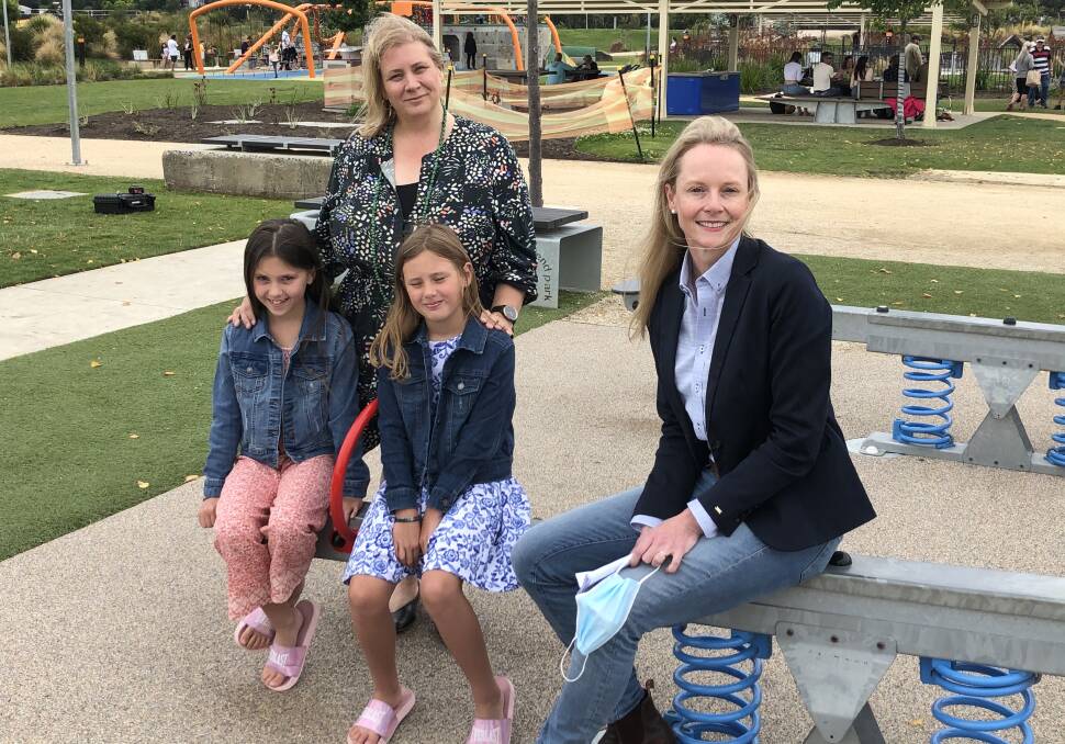 Education Minister Sarah Courtney with Joanne Long's twins Claudia and Sophie who are looking forward to the start of the school year next month.