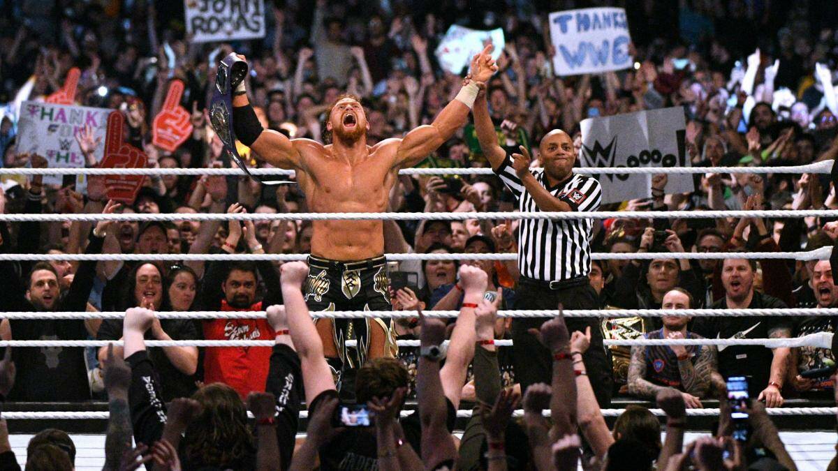 HOME-TOWN HERO: Former WWE wrestler Buddy Murphy celebrates winning the cruiserweight title in Melbourne. Picture: Twitter
