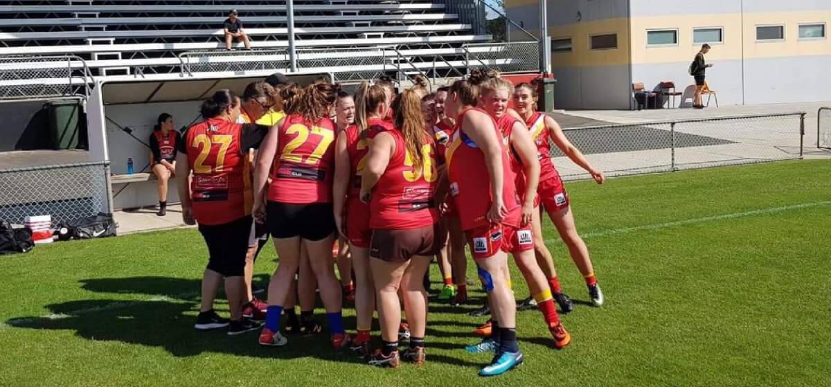 Huddle: Meander Valley's women's team get advice during a practice match against the Ulverstone Robins earlier this year. Picture: Supplied.