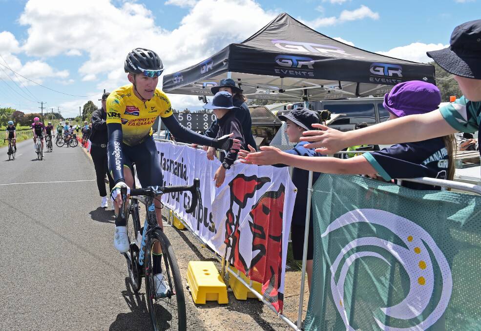 Leading: Stage three winner and general classification leader, Dylan Sunderland, high-fives some admirers. Picture: Stephen Harman 