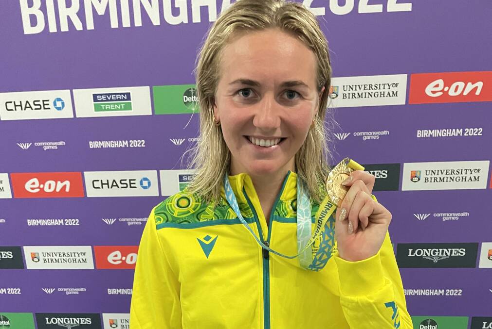 SHINING BRIGHT: Ariarne Titmus with her third gold medal of the Commonwealth Games. Picture: TIS