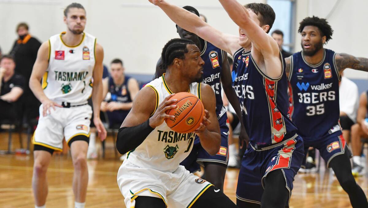 Surrounded: MiKyle McIntosh takes on the Adelaide 36ers during the NBL Blitz. Picture: Brodie Weeding
