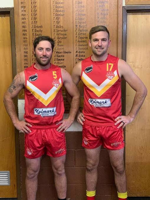 In arms: Meander Valley Suns pair Rob Shaw and Alex Wadley will play their 100th game for the club on Saturday. Picture: Supplied.