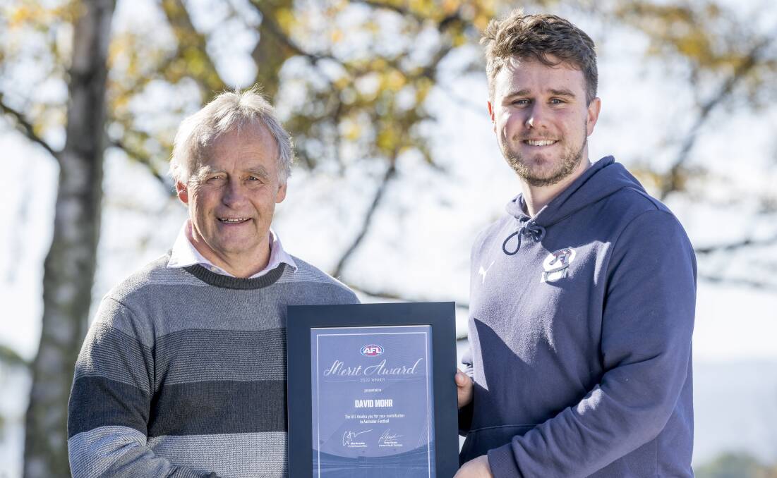 David Mohr receiving his Merit Award from AFL Tasmania's Anthony Osborn. Picture by Phillip Biggs