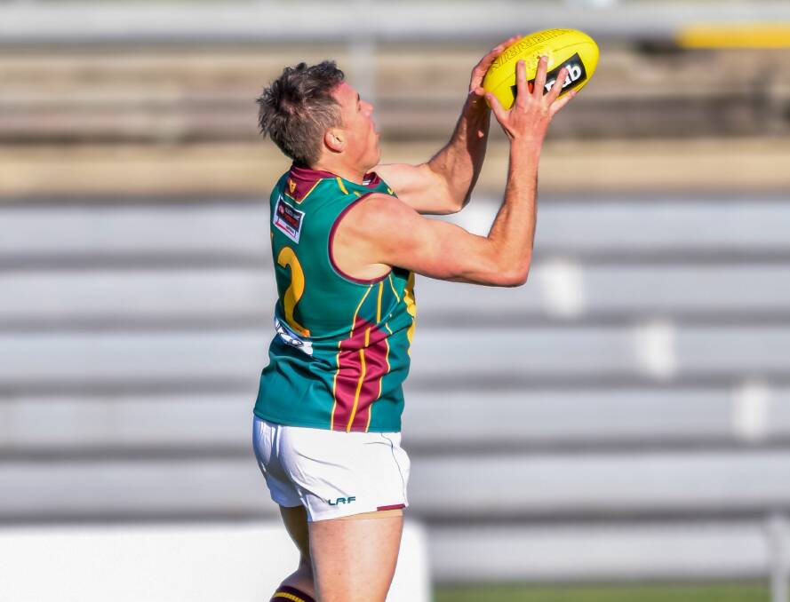 Quick grab: Matthew Richardson in Tasmanian colours in 2017, colours which he believes will grace the AFL.