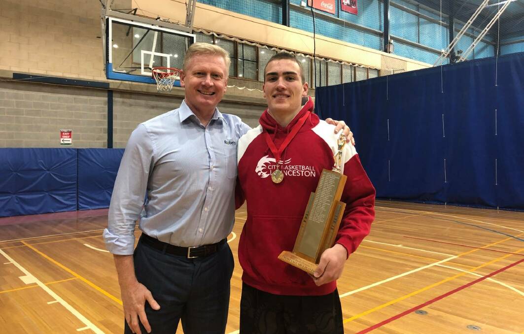 Arm in arm: Division one most valuable player Sejr Deans with coach Brett Smith, who the award is named after. Picture: Supplied