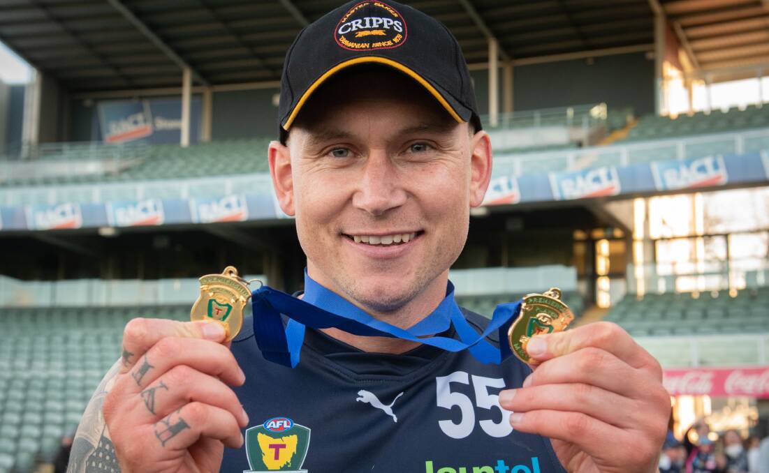 BACK FOR MORE: Launceston playing coach Mitch Thorp with his premiership medals. Picture: Paul Scambler