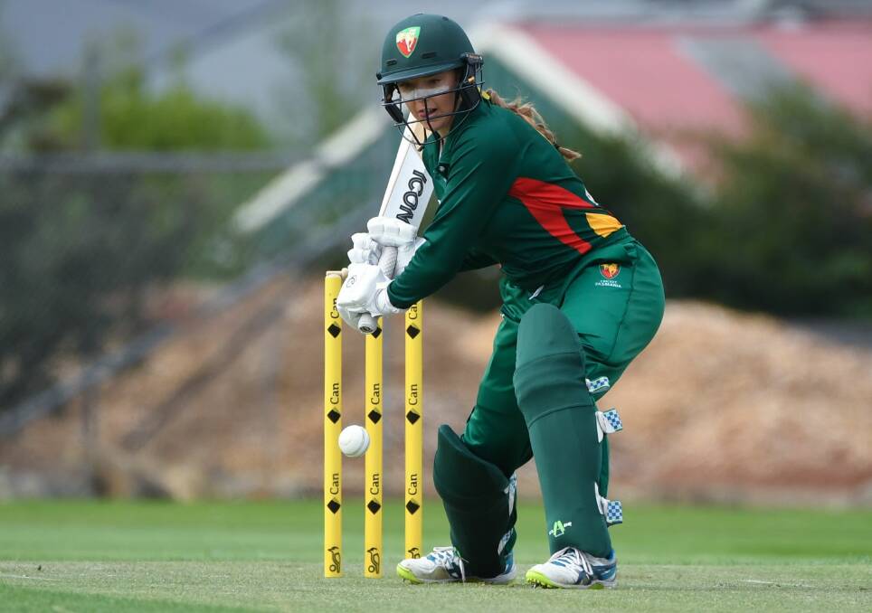 Icy glare: Melodie Armstrong looks to hit the ball through the covers as Tasmania take on Victoria Country. Picture: Neil Richardson