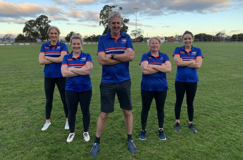 Standing tall: Adrian Dean stands alongside his leadership group in Kate Greaves, Hannah Viney, Kate Child and Emma Attard. Picture: Supplied