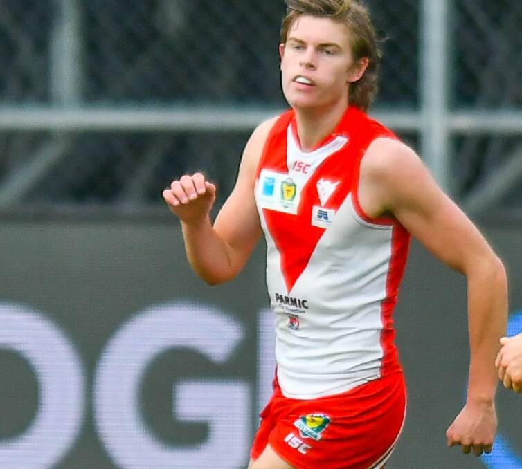 On the run: Clarence's Fraser Turner in action before being drafted to Richmond.