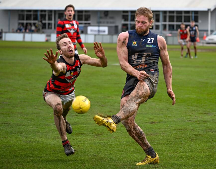 Launceston's Jamieson House kicks the ball forward in challenging conditions last week. Picture by Paul Scambler
