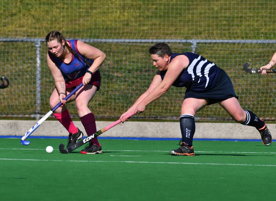Launceston City's Lynette Stebbings desperately tries to stop her South Burnie opponent. Picture: Brodie Weeding