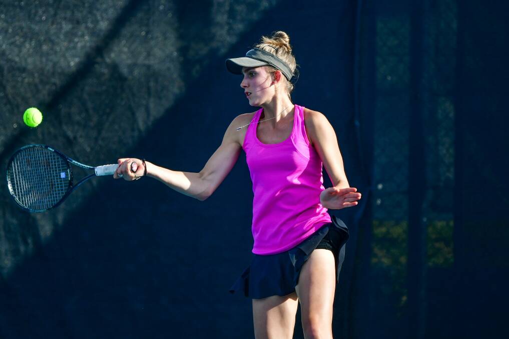 Catherine Krueger hits a forehand in her commanding win on Saturday