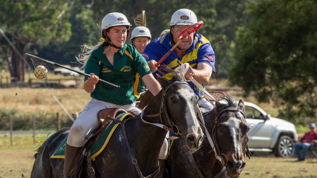 Hot pursuit: Central Coast's Richard Murrell attempts to chase down Emily Shadbolt of Kentish in the state polocrosse championships at Gowrie Park. Picture: TLJ Photography