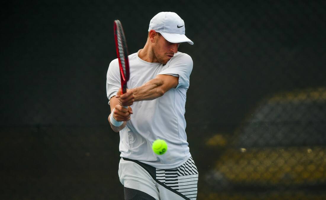 Strong: Hobart's Edward Bourchier hits a backhand in his 6-1 6-0 win against Sam Edgar. Picture: Scott Gelston
