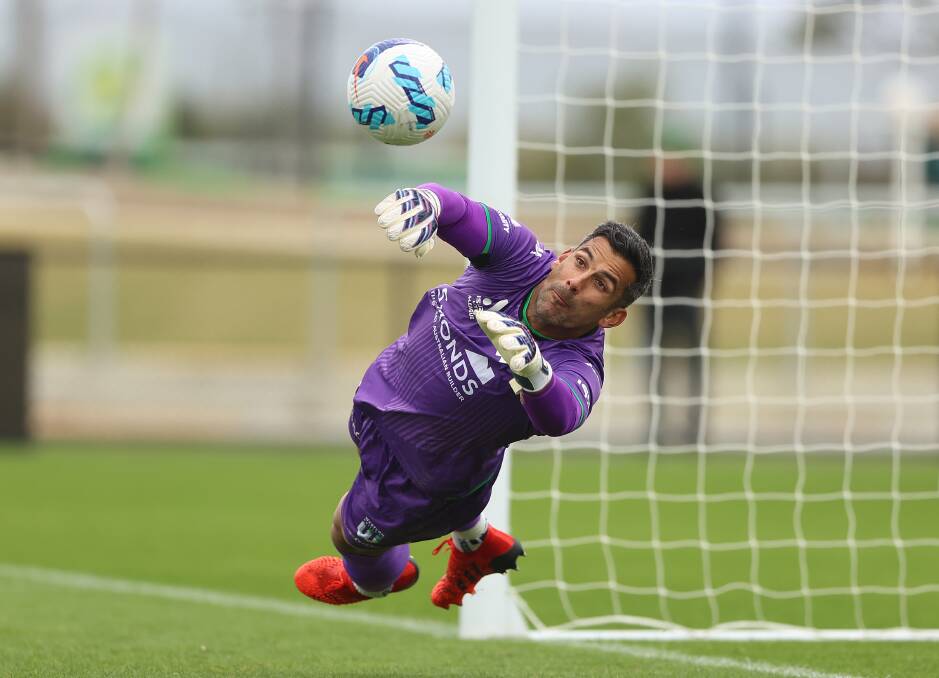 MID-FLIGHT: Western United goalkeeper Jamie Young dives to save a penalty. Picture: Getty Images