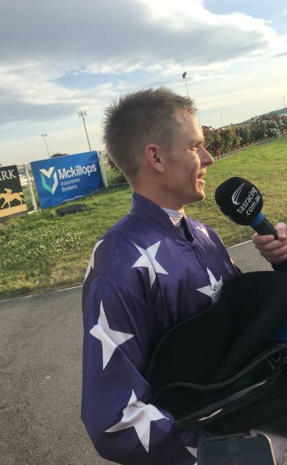 Chuffed: Winning jockey Troy Baker discusses his ride on John Blacker-trained Blaze Forth following the running of the $100,000 Conquering Stakes. Picture: Josh Partridge