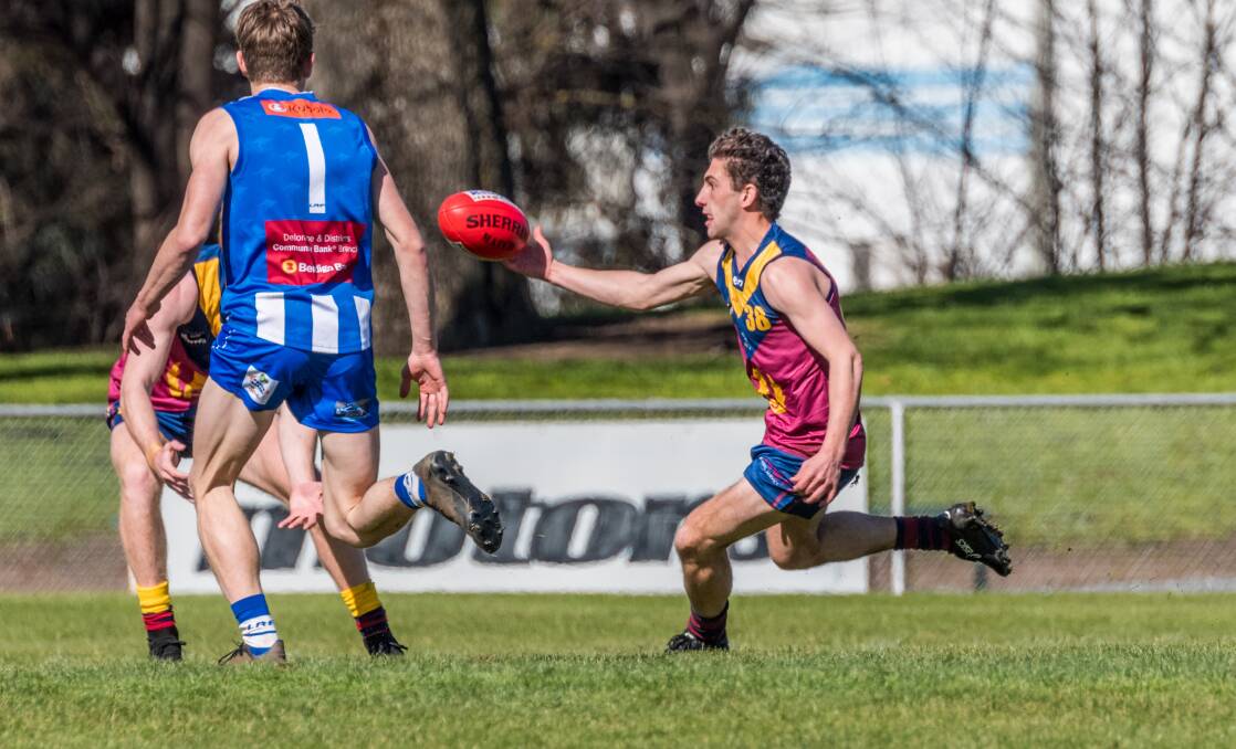 Poise: Old Scotch's Lachlan Gee looks to control the Sherrin during last week's contest. Picture: Phillip Biggs