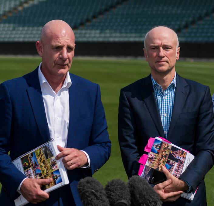Side by side: Peter Gutwein and Brett Godfrey deliver the findings of the Tasmanian AFL taskforce in February 2020. Picture: Phillip Biggs