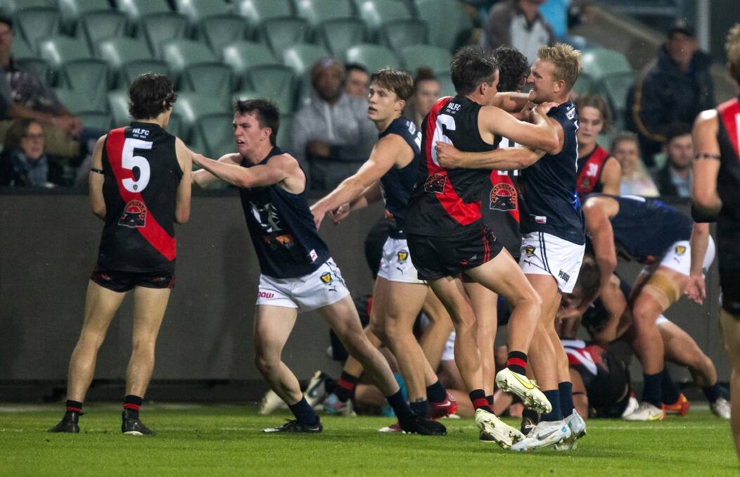It was a fiery clash as North Launceston and Launceston renewed hostilities on Friday night. Pictures by Phillip Biggs