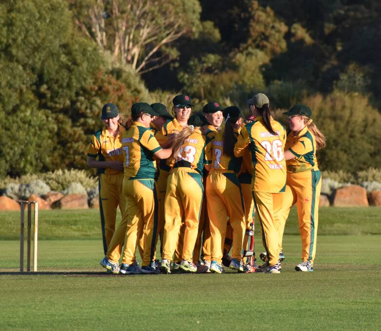 Elation: South Launceston's women's side celebrate their fifth consecutive Cricket North grand final victory. Picture: Josh Partridge