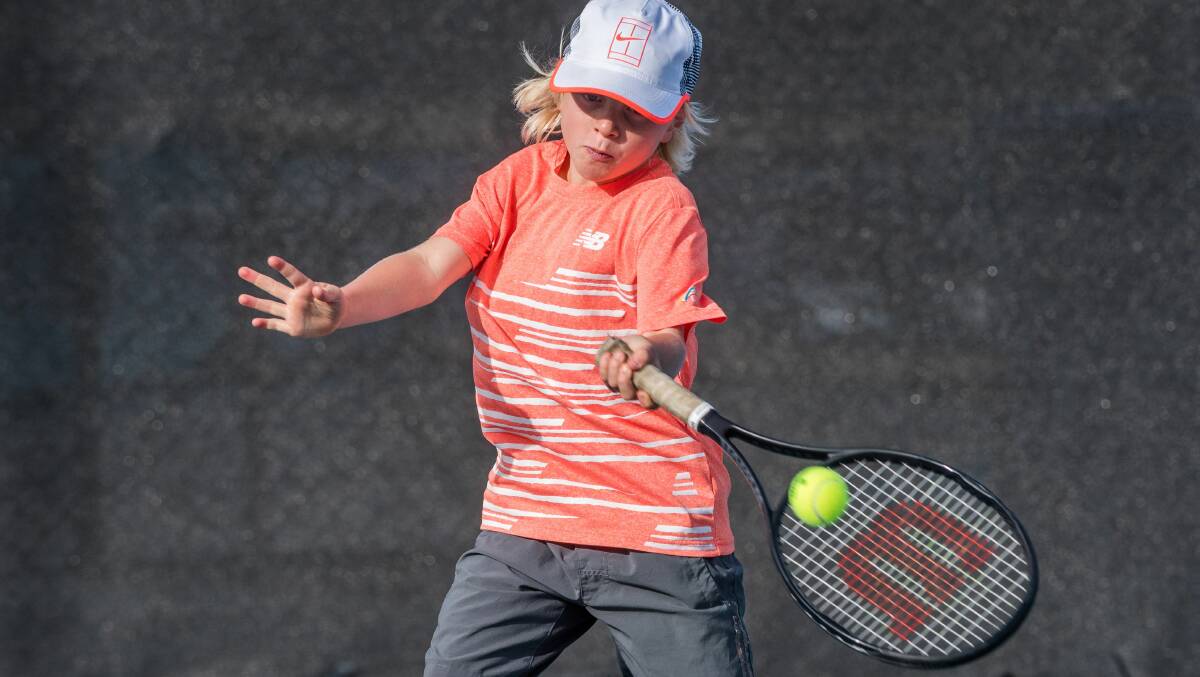 Grinding Away: Ten-year-old Oliver Carswell credits the Super 10s for helping to achieve his tennis dream. Picture: Phillip Biggs
