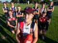 CLOSE: George Town's Hayden Simmons with coaches Alec Daniels and Lachie Mason, teammates and Launceston opponents. Pictures: Phillip Biggs