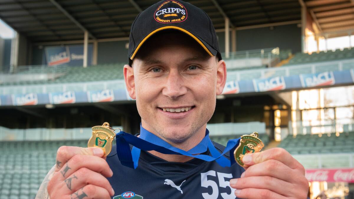 Launceston playing coach Mitch Thorp with his premiership medals in 2021. Picture by Paul Scambler