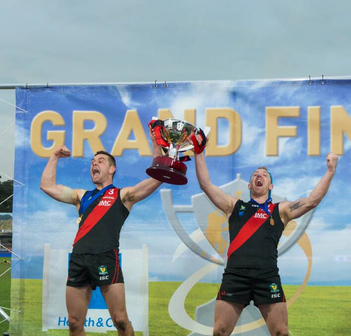 Taylor Whitford and Brad Cox-Goodyer celebrate winning the 2019 TSL grand final in Hobart. Picture by Phillip Biggs