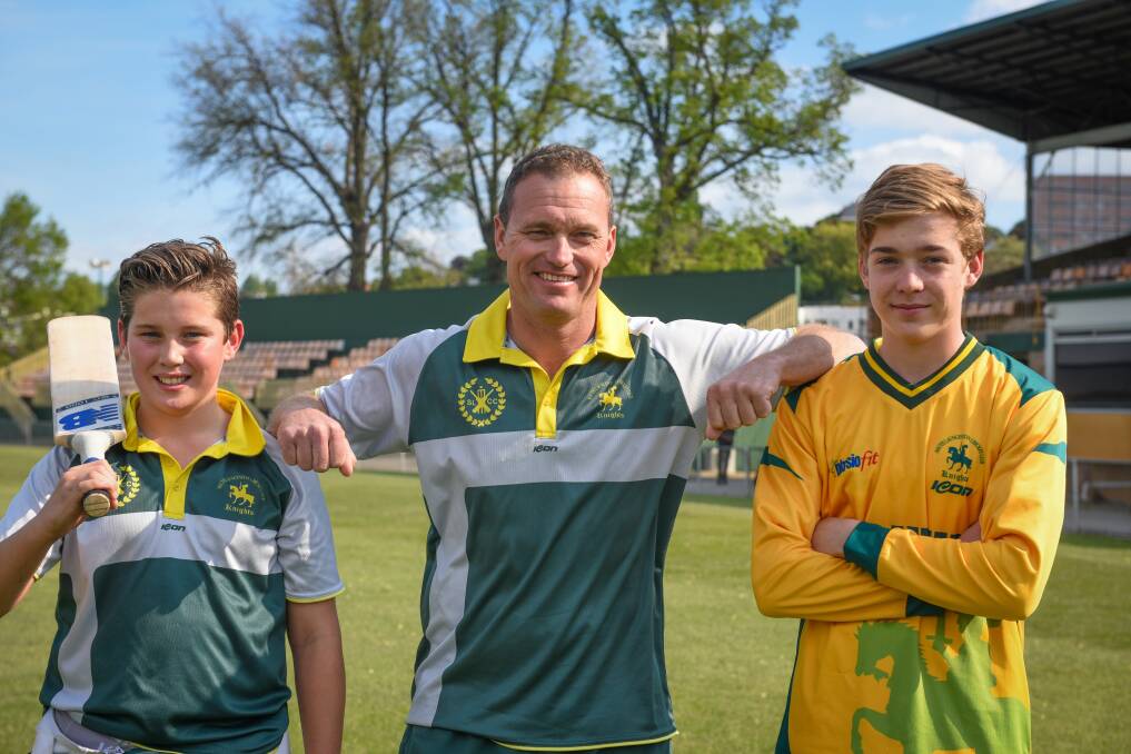 Knighthood: South Launceston's Andrew Arnott, with sons Ethan and Ryan. Picture: Paul Scambler
