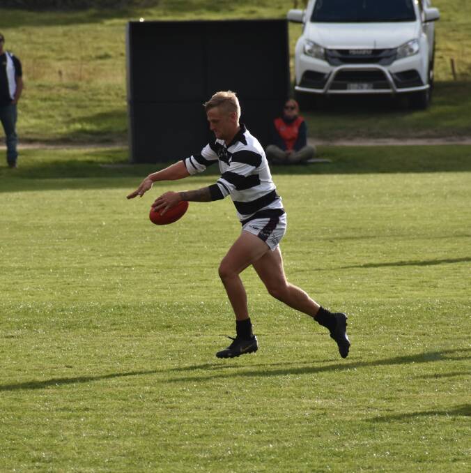STAR: Reuben Rothwell, kitted in Lilydale's 100-year strip, streams through the middle. Picture: Josh Partridge