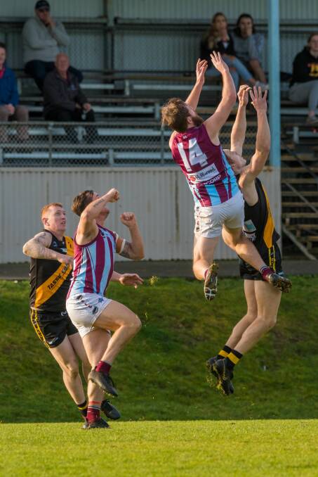 Up there Howey: Hillwood's Damon Howe channels his Collingwood name sake as he attempts to take a hanger. Pictures: Phillip Biggs.