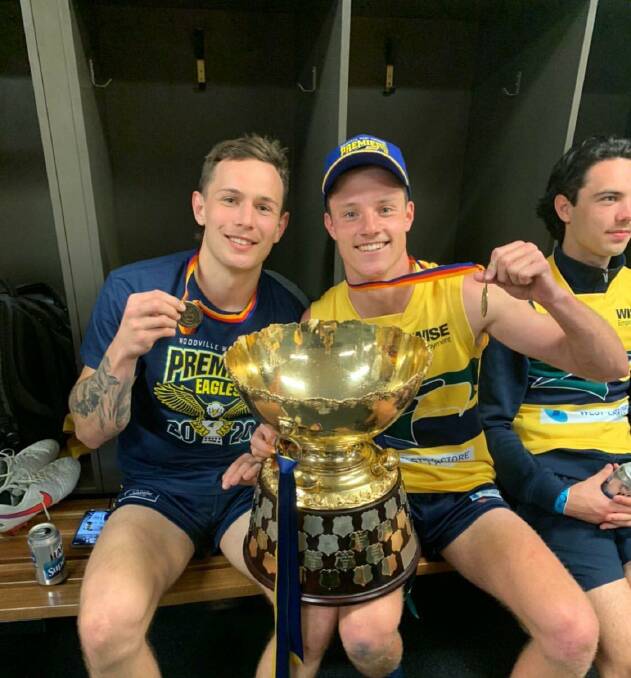 Flying high: Rhyan Mansell and Woodville-West Torrens teammate Jacob Wehr celebrate SANFL premiership victory. Picture: Supplied