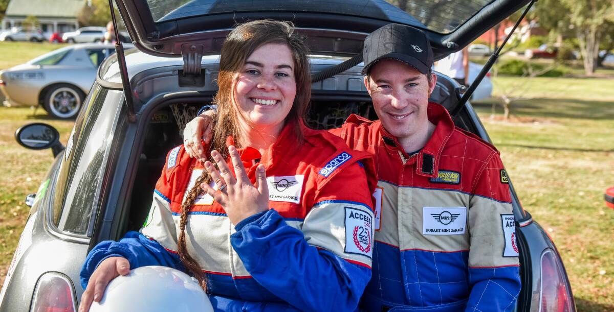 All smiles: Casey Price and Daniel Willson, from the Huon Valley, in the back of their Mini Cooper S, competing Targa Tasmania for the first time as a duo. Picture: Neil Richardson.