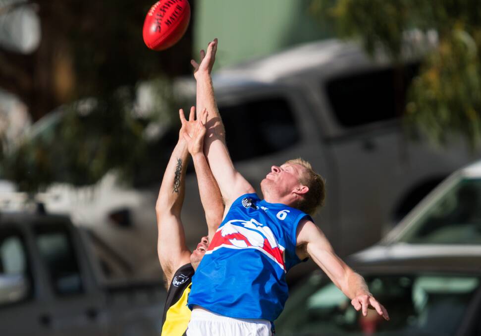 TALL TIMBER: South Launceston's most improved, Kurt Hibbs, gets airborne. Pictures: Phillip Biggs
