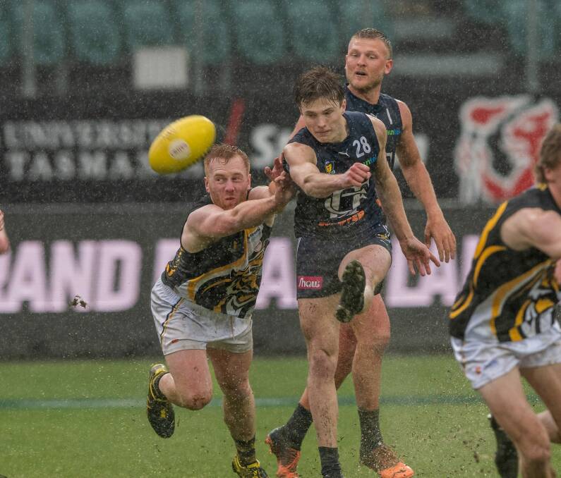 Action from the Tasmanian State League grand final last year. Picture by Phillip Biggs