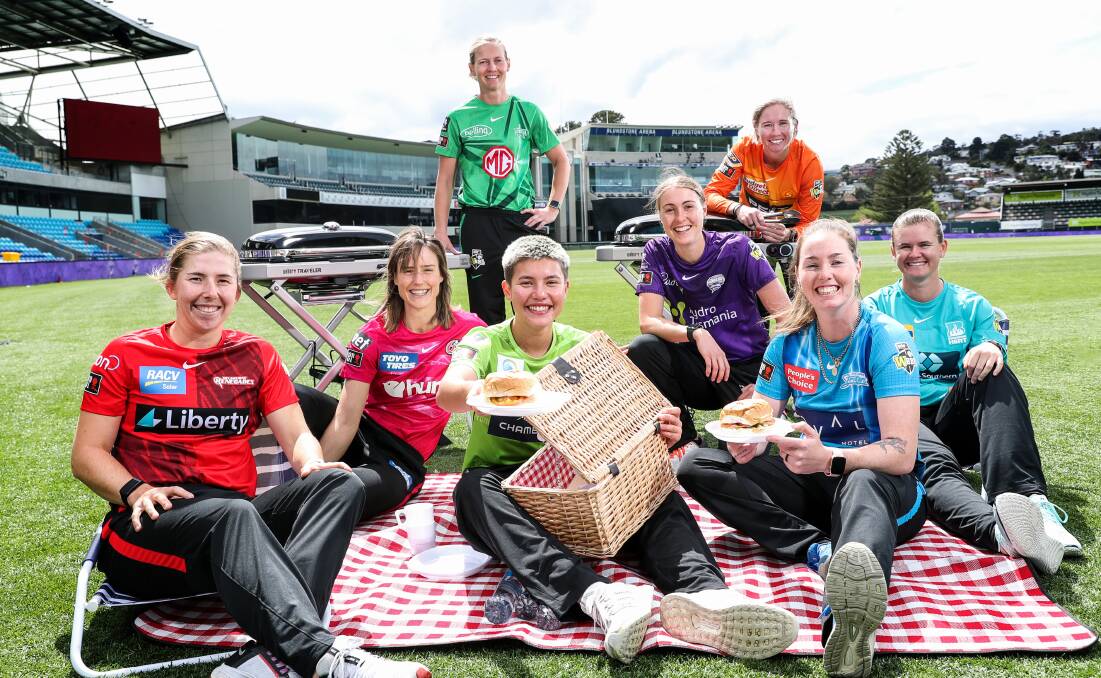 RELAXING: Players from each WBBL team take a time out before the competition gets underway on Thursday. Picture: Sarah Reed/Getty Images