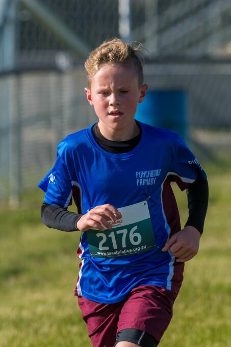 Determined: Punchbowl Primary's Kie McKendrick keeps on going at the all-schools cross-country at Symmons Plains.