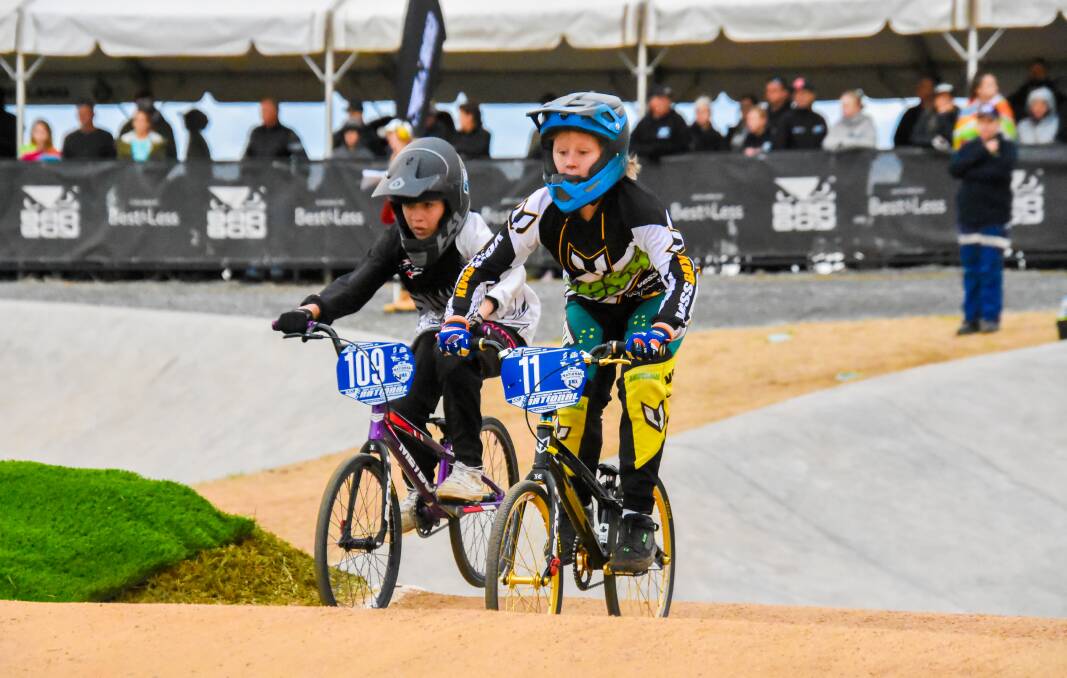 In the zone: Amy Bracken, right, competes at the BMX national titles.