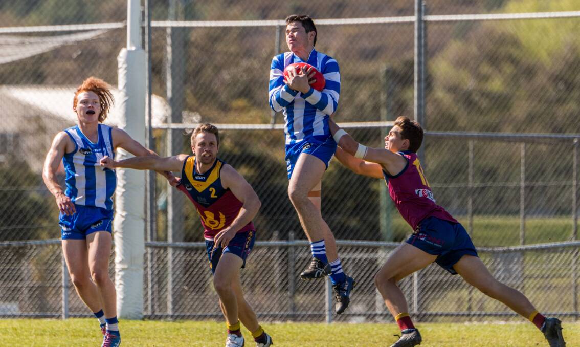 Plucked it: Deloraine co-captain Stan Tyson marks in front of Charlie Eastoe. Picture: Phillip Biggs
