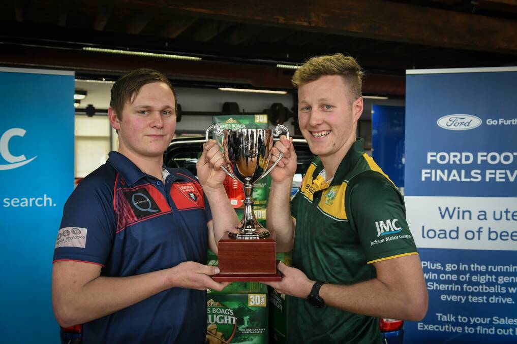 Corey Lockett and Tom Hilder with the premiership cup. Picture: Paul Scambler