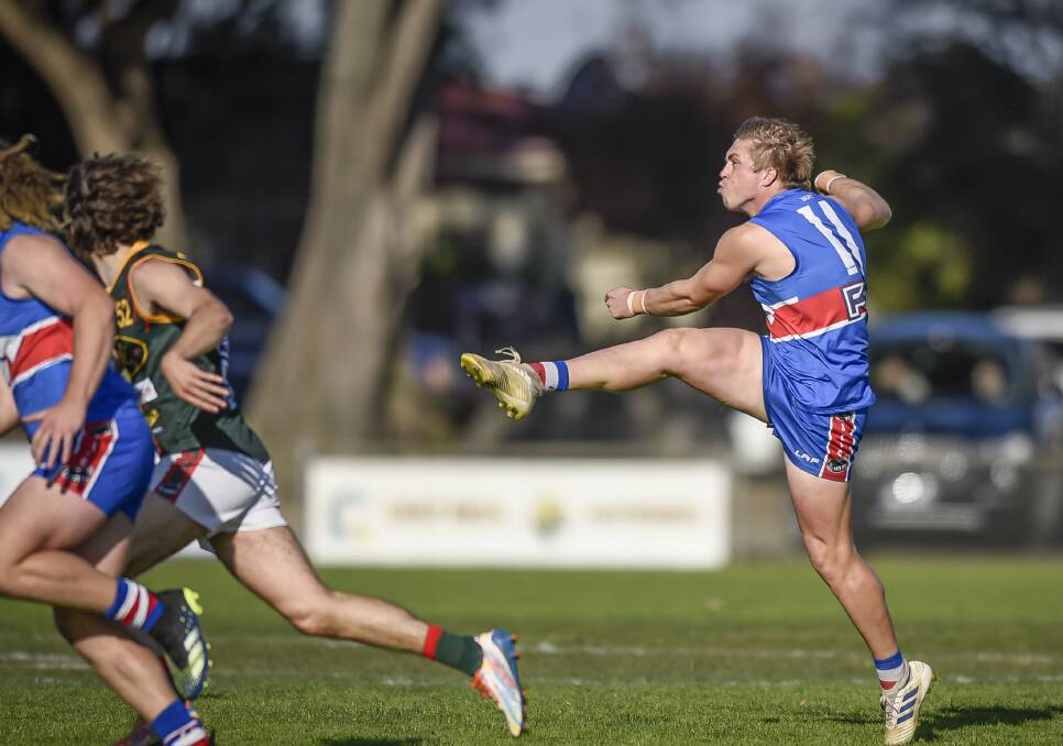 CLEAR THE WAY: Lachie Cocker kicks forward for South Launceston. Picture: Craig George