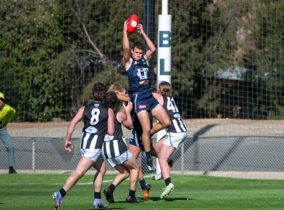 STRONG GRAB: Launceston's Josiah Burling will return to the senior side this weekend. Picture: Paul Scambler
