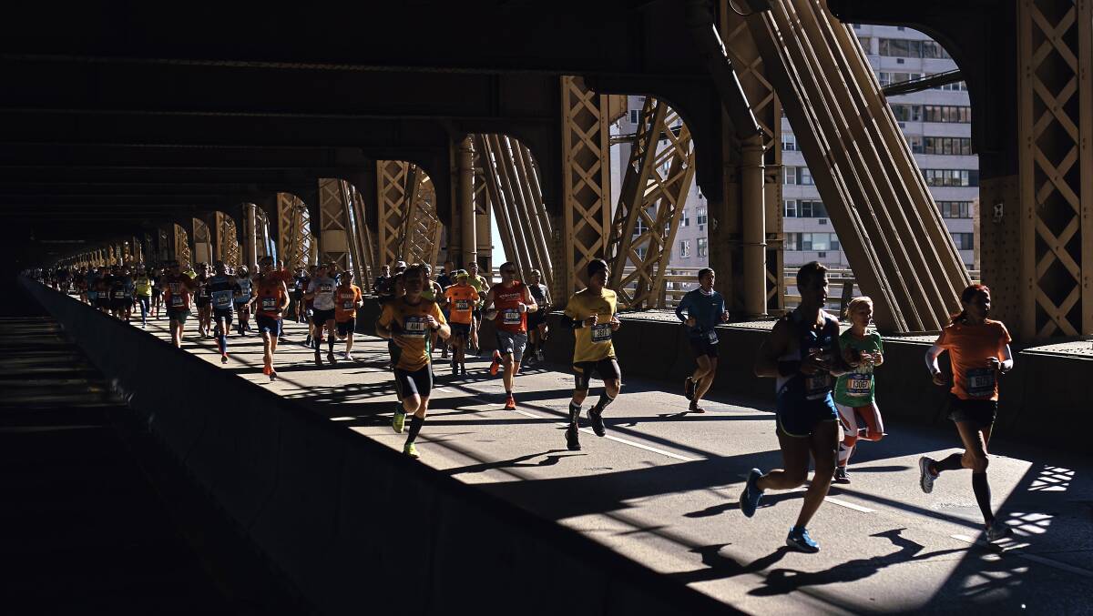 Runners cross the Queensboro bridge during the New York City Marathon in New York, one of the world's major marathon events.