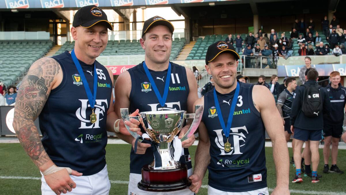 Mitch Thorp, Jobi Harper and Jay Blackberry celebrate the 2021 premiership. The trio have been involved in four premierships together. Picture by Paul Scambler