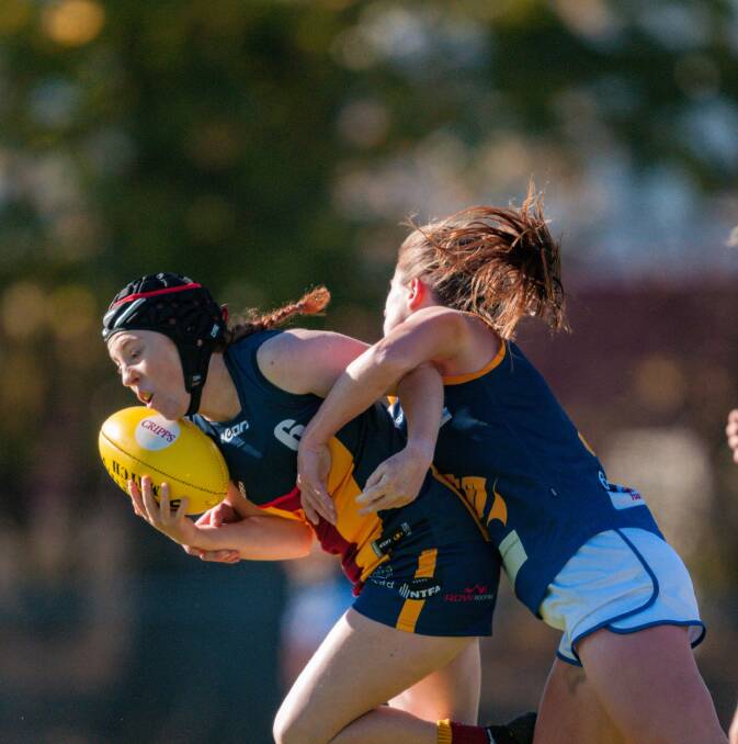 Got her: Old Scotch's Raigan Kettle is tackled by Evandale's Emma Groves earlier this year. Picture: Phillip Biggs