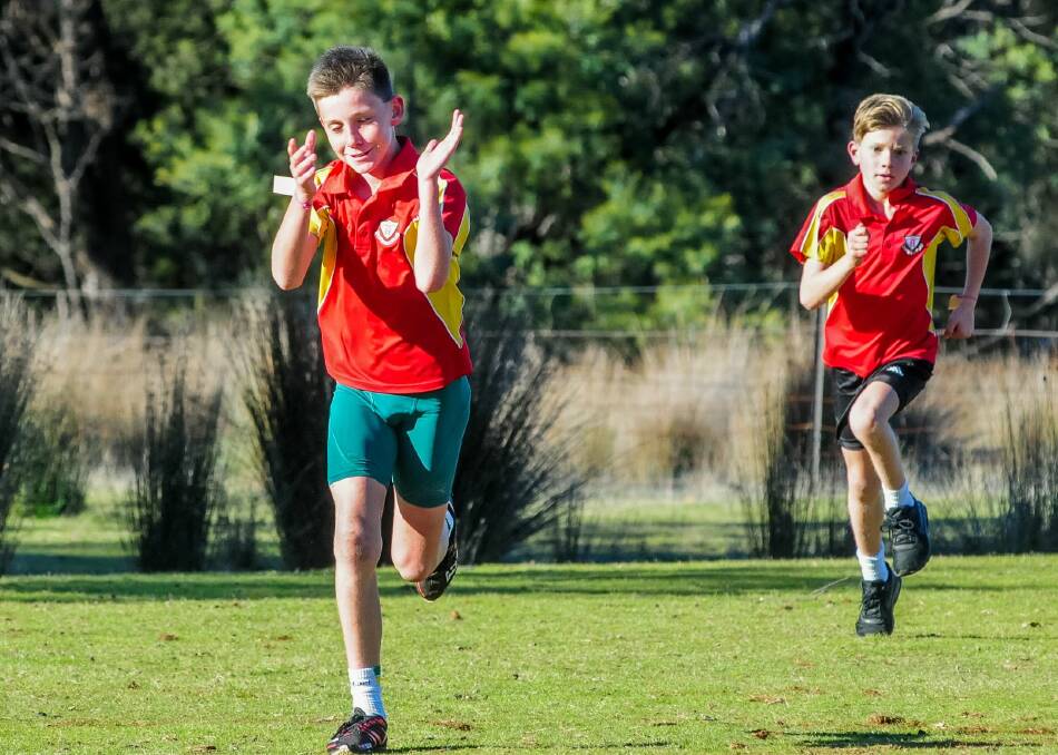 Xavier shares a light-hearted moment in the Newstead Athletics school series. Picture: Neil Richardson.