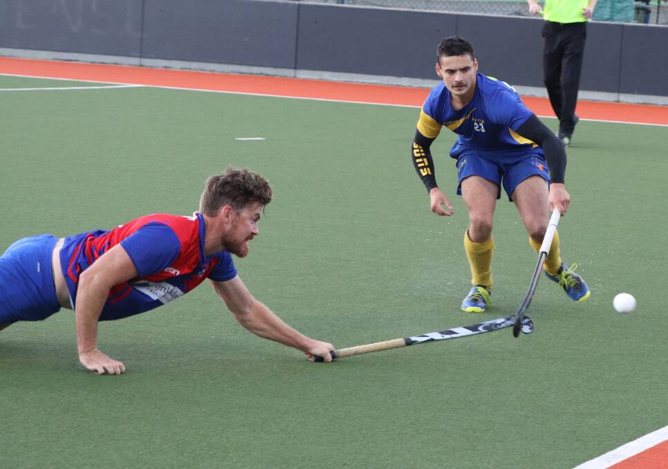 DESPERATE: Queechy's Ryan Horne hits the turf to defend South Launceston's Kurt Budgeon. Pictures: Brett Jarvis