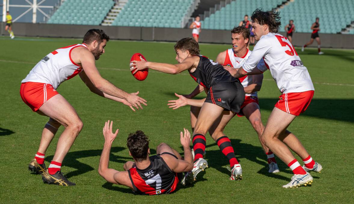 North Launceston and Clarence compete for the ball during a TSL match at UTAS Stadium last weekend. Picture by Paul Scambler