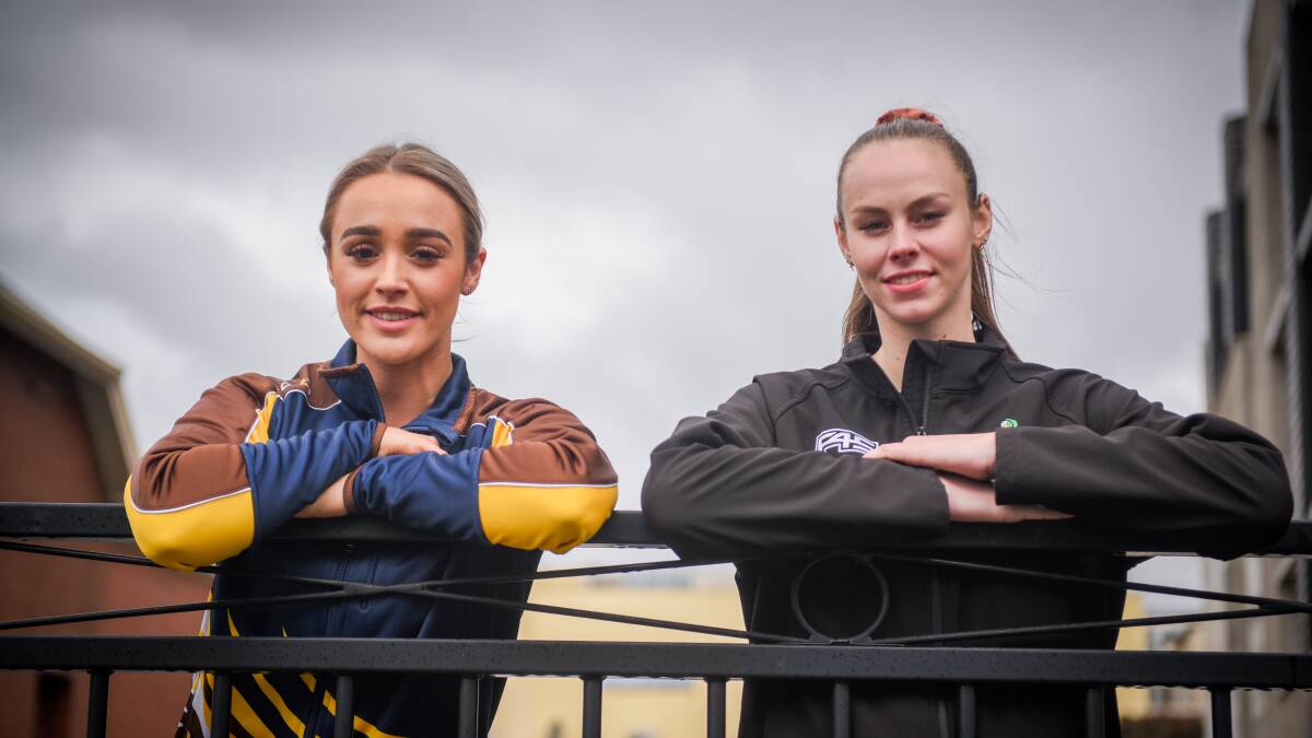 Ready to go: Opponents Chelsea Mawer and Courtney Treloar stand side-by-side. Picture: Paul Scambler